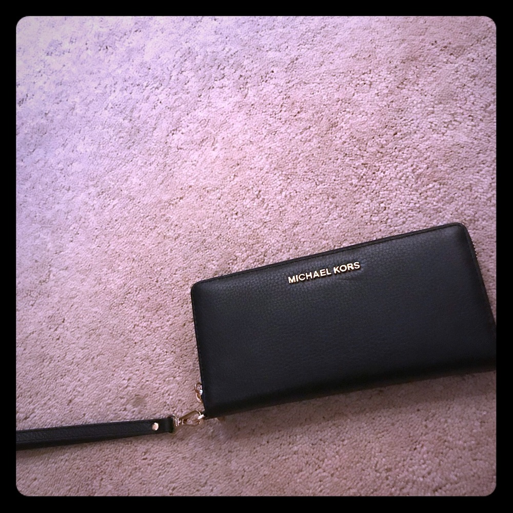 Brand NEW with tag. Jet set travel wristlet